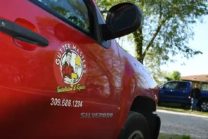 The side of a Peoria Gutter Masters truck, ready to provide commercial gutter services in Peoria, IL and Bloomington-Normal IL